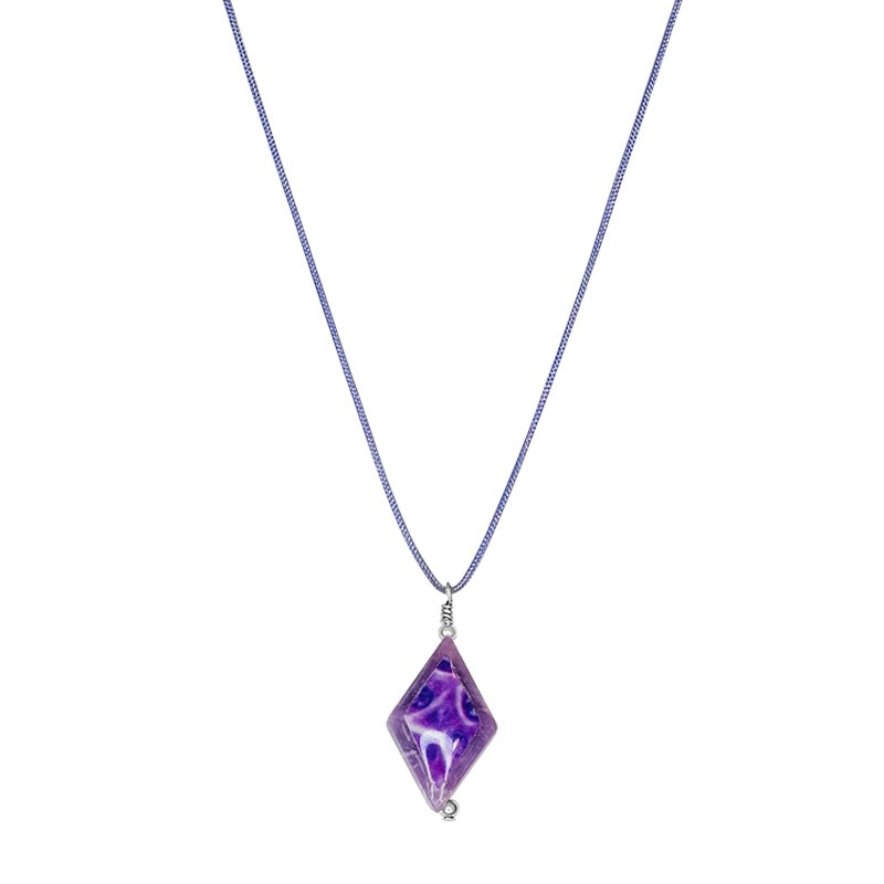 close up of diamond shaped lepidolite stone pendant necklace on purple cord featuring pancreatic cancer cell image in resin