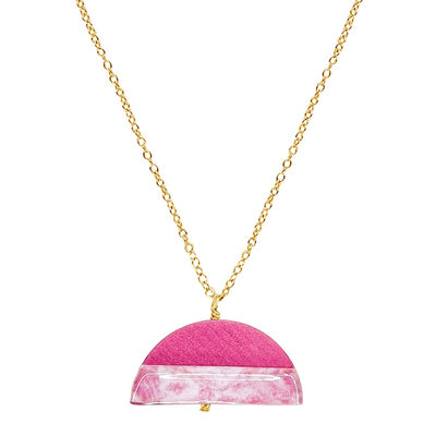 close up of half circle necklace for breast cancer in pink wood with resin cell image and 14k gold filled chain