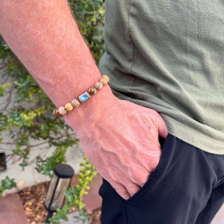 model wearing mens bracelet with picture jasper and diabetes cell image in resin pendant on stretch cord