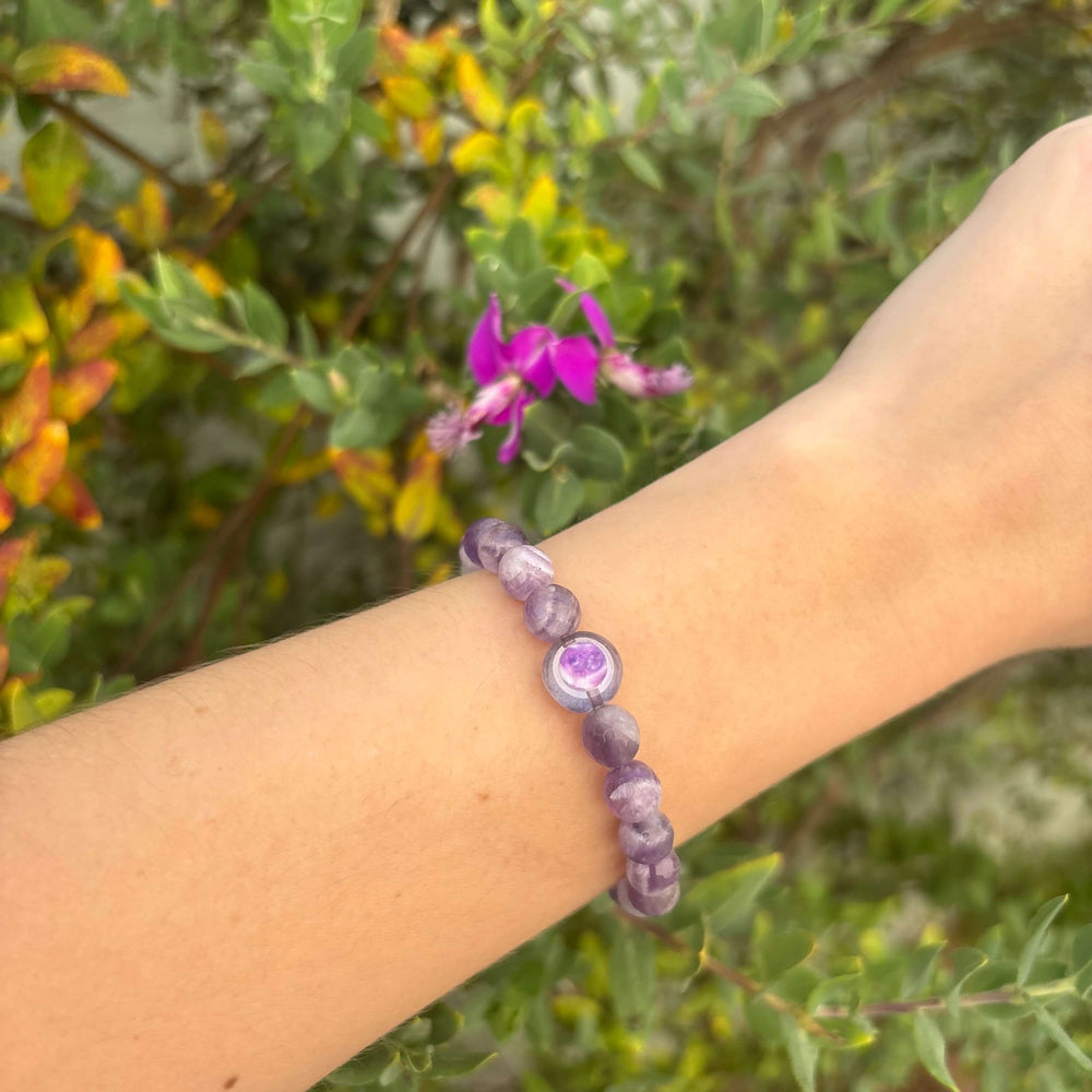 purple teeth amethyst stone stretch bracelet with pancreatic cancer cell image in resin pendant on model