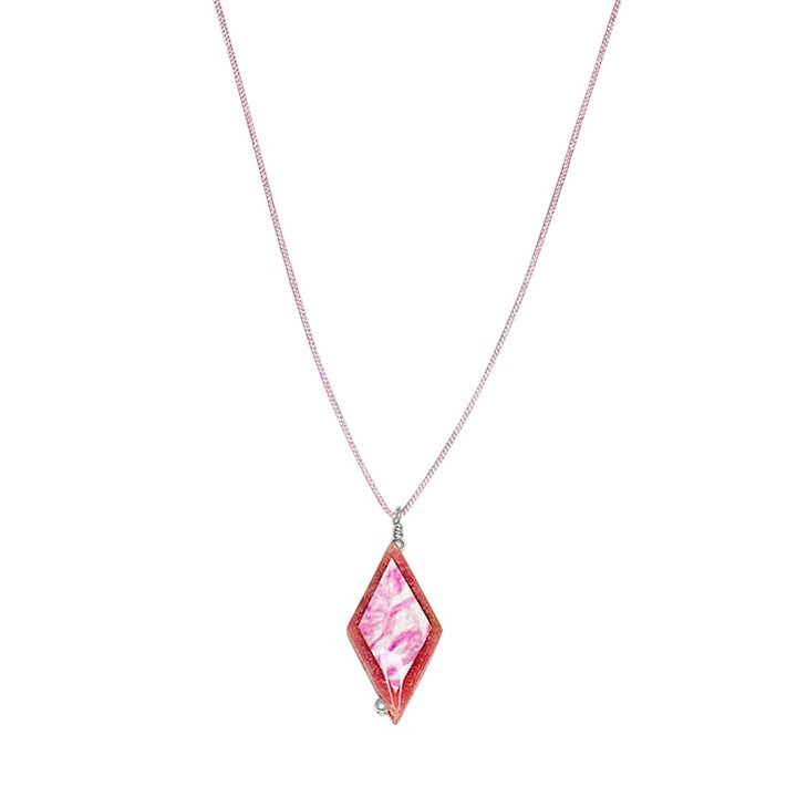 close up of diamond shaped pink rhodonite stone pendant necklace on pink cord featuring breast cancer cell image in resin