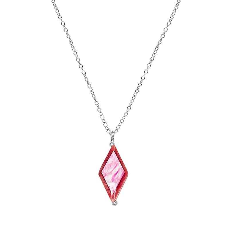 close up of diamond shaped pink rhodonite stone pendant necklace on Sterling silver  chain featuring breast cancer cell image in resin