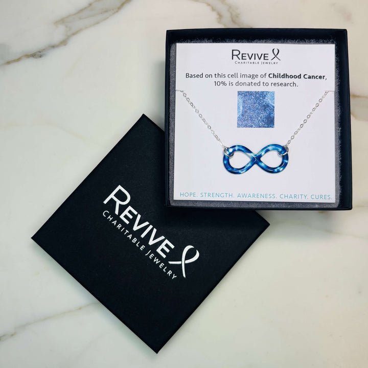 childhood cancer cell image infinity symbol pendant with resin and Sterling silver chain necklace with product packaging