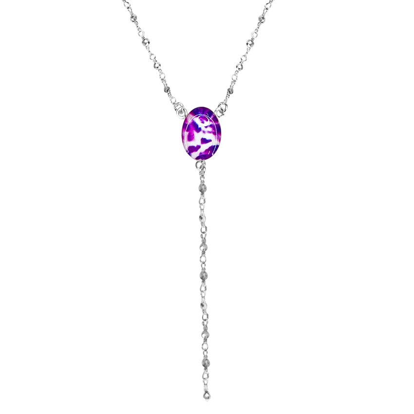 close up of y necklace for pancreatic cancer with cell image resin pendant and rosary style silver pyrite linked chain