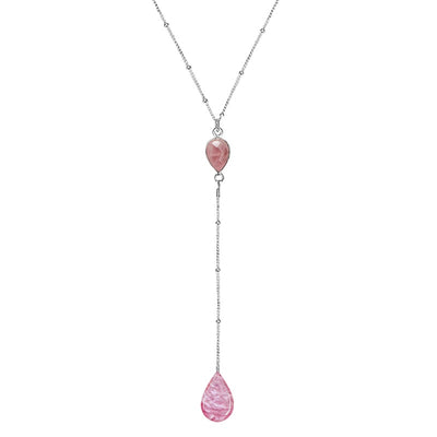 close up of pink drop necklace for breast cancer with rose quartz and cell image in resin teardrop pendants and sterling silver chain