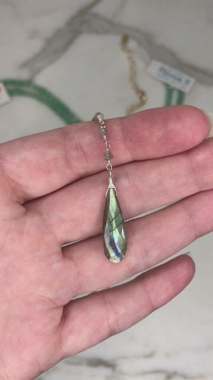 Video of model showing close up of long MS necklace pendant and labradorite stones.