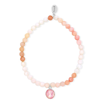 Breast cancer awareness bracelet with pink opal stones and small round sterling silver pendant.