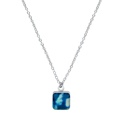 close up of square blue pendant chain necklace for childhood cancer awareness gives back to research