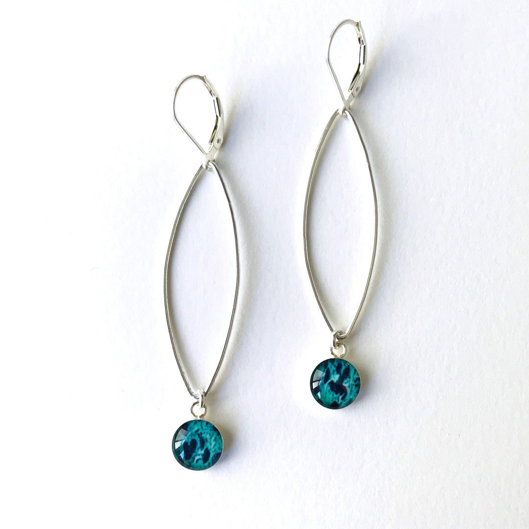 Petal Ovarian Cancer earrings in sterling silver with teal pendants. 