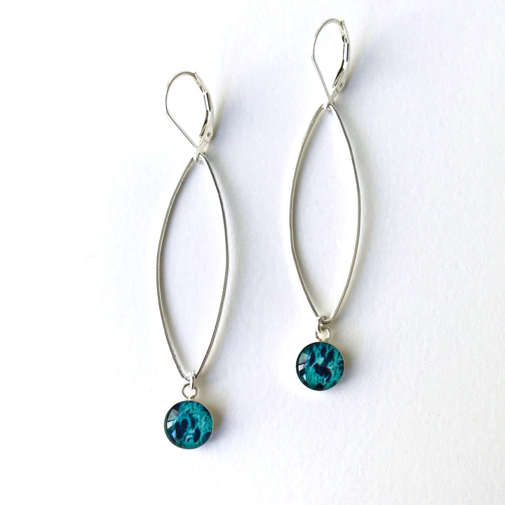 Petal Ovarian Cancer earrings in sterling silver with teal pendants. 