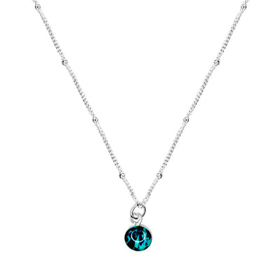 close up of teal ovarian cancer awareness necklace that gives back to charity