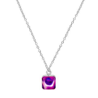 close up of purple pancreatic cancer awareness resin pendant on Sterling silver chain necklace