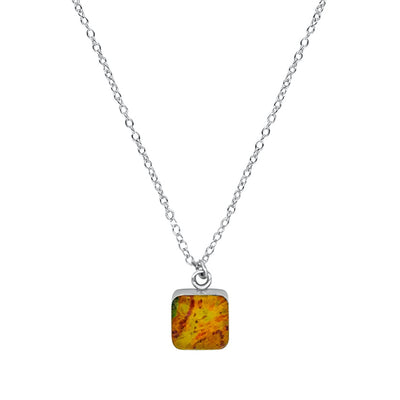 close up of square yellow, orange and red pendant chain necklace for prostate cancer awareness gives back to research