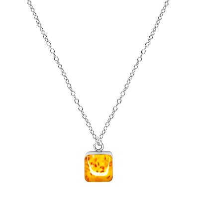 close up of Sterling silver chain necklace with square yellow sarcoma awareness pendant