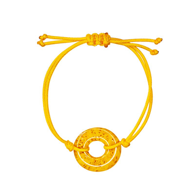 yellow adjustable cord sarcoma awareness bracelet that gives back to charity