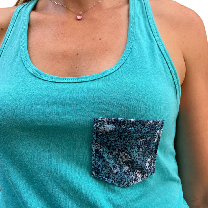 close up of model wearing ovarian cancer cell image pocket on tank top